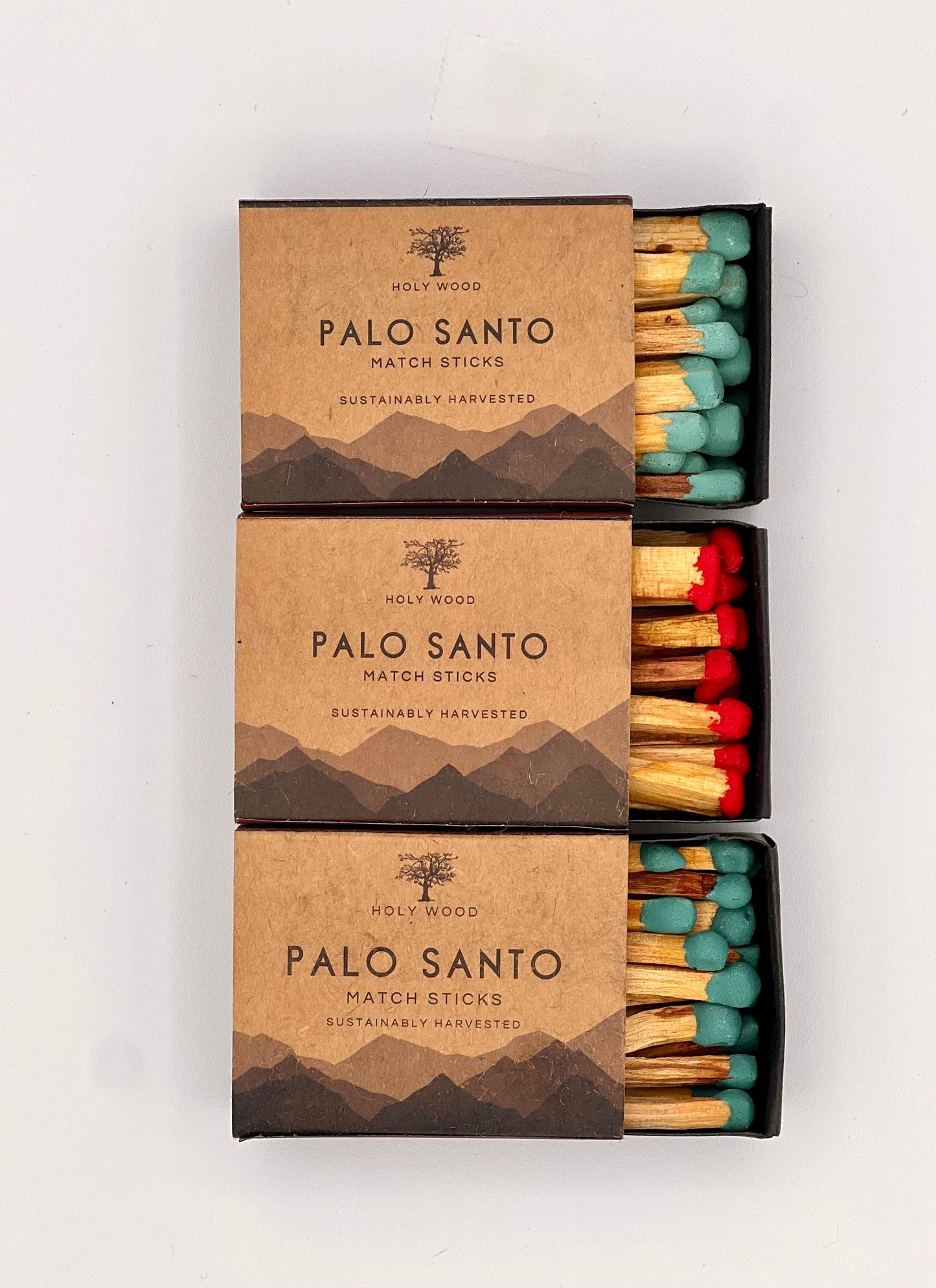 Three boxes of Palo Santo matchsticks with different colored matches on a white background.