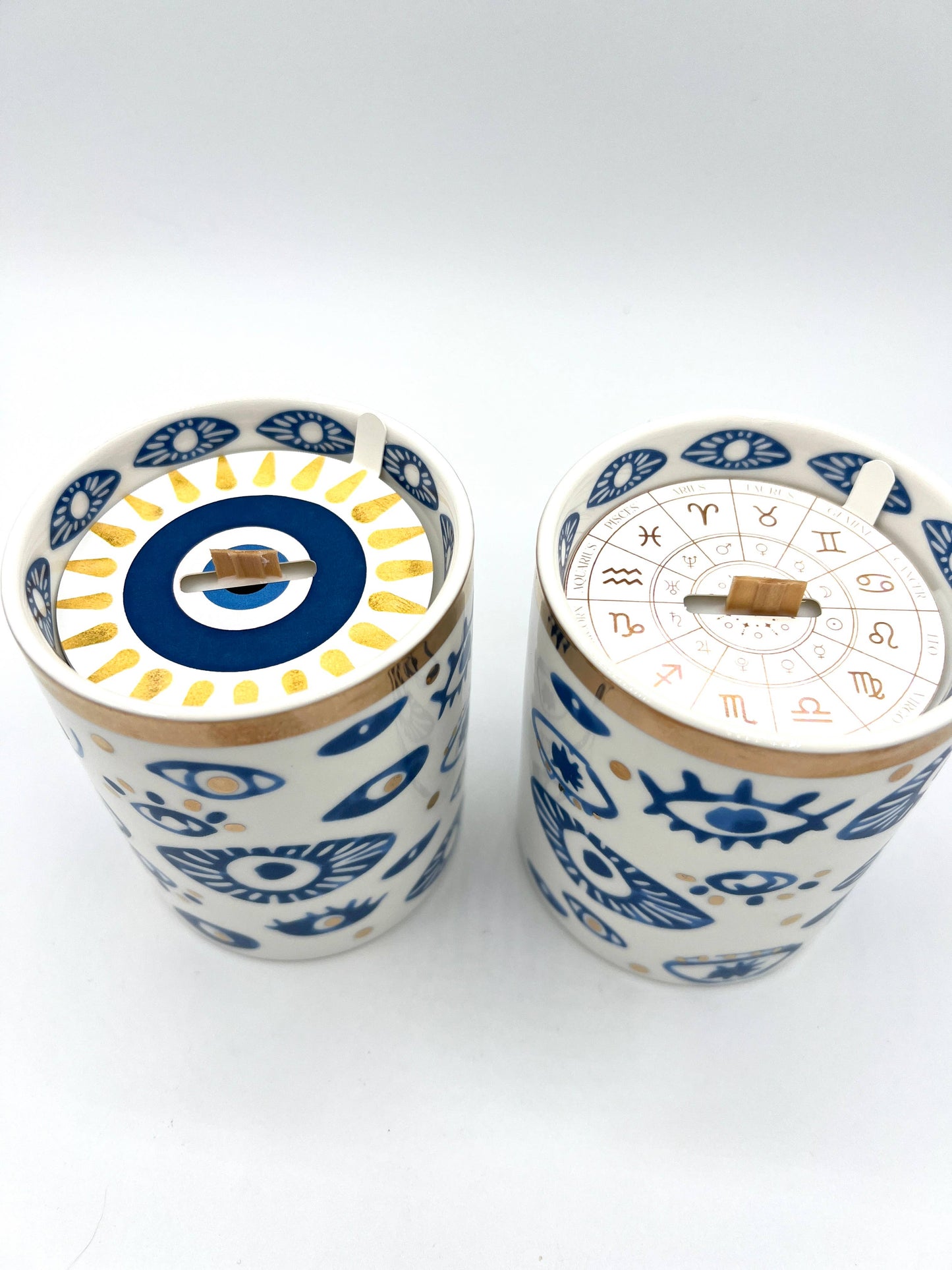 Two decorative items with blue and white patterns on a white background