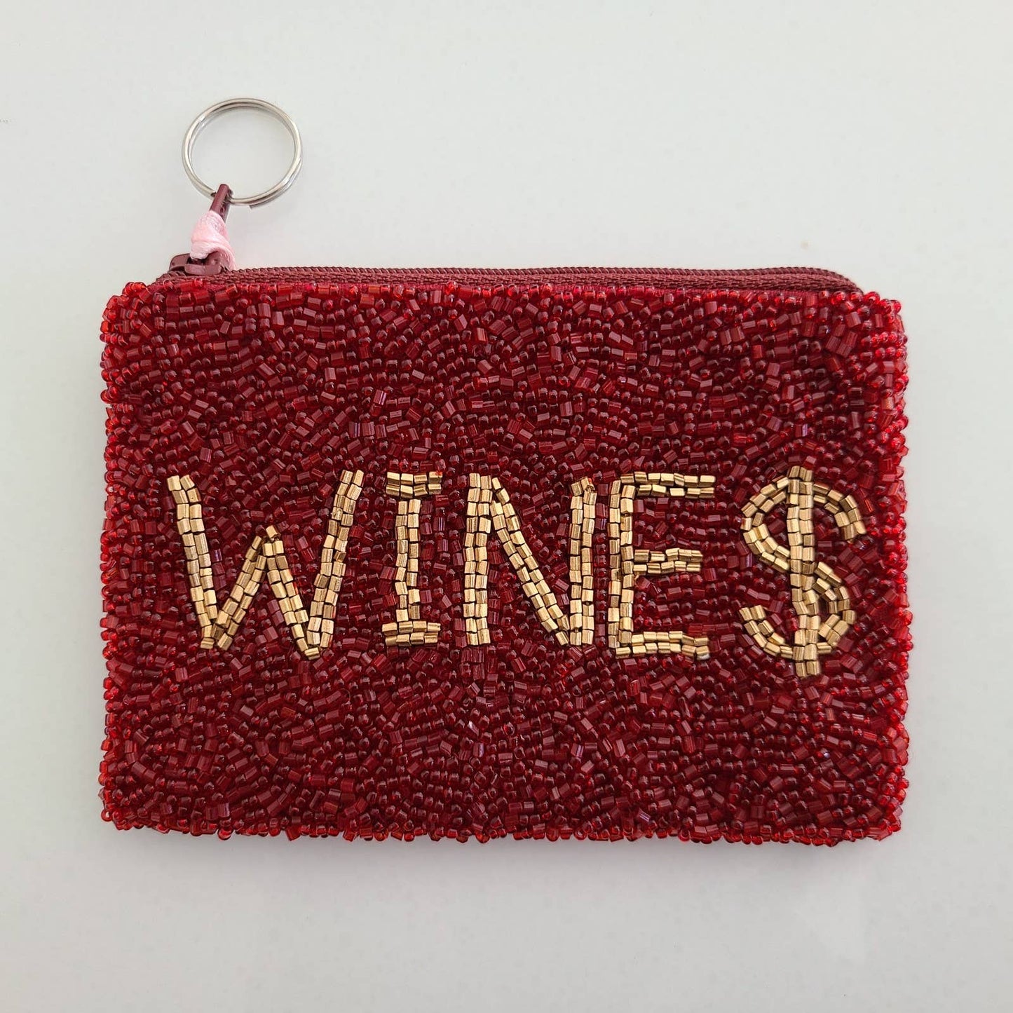 beaded coin purse with gold "WINE $" on red background